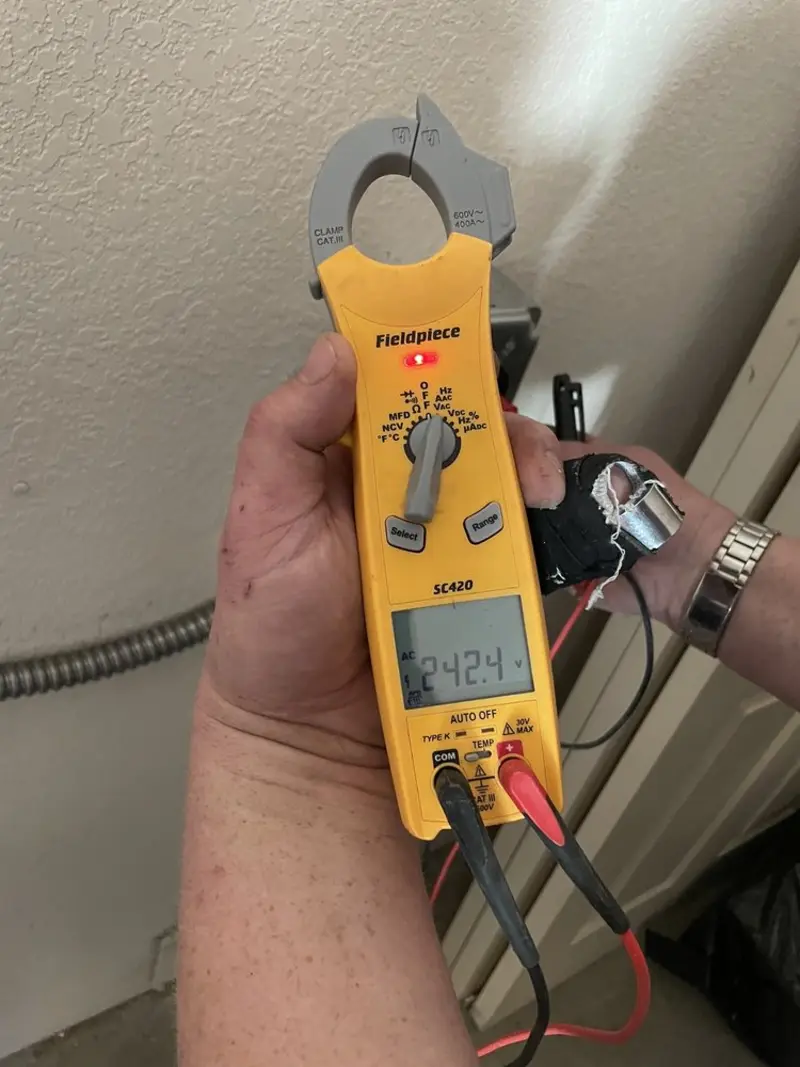 Voltage testing with clamp meter during Electrical Installation Services in South Whitehall